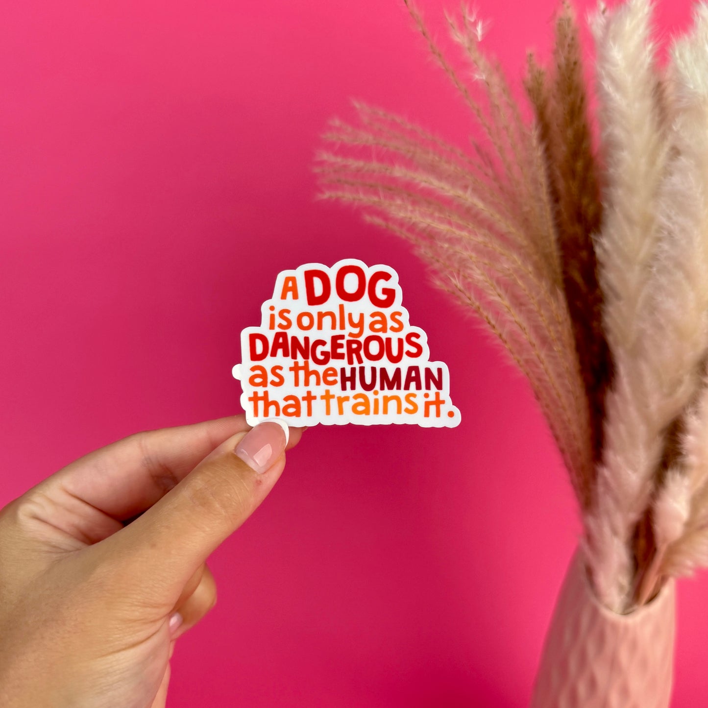 A Dog is only as Dangerous as the Human that trains it die cut sticker